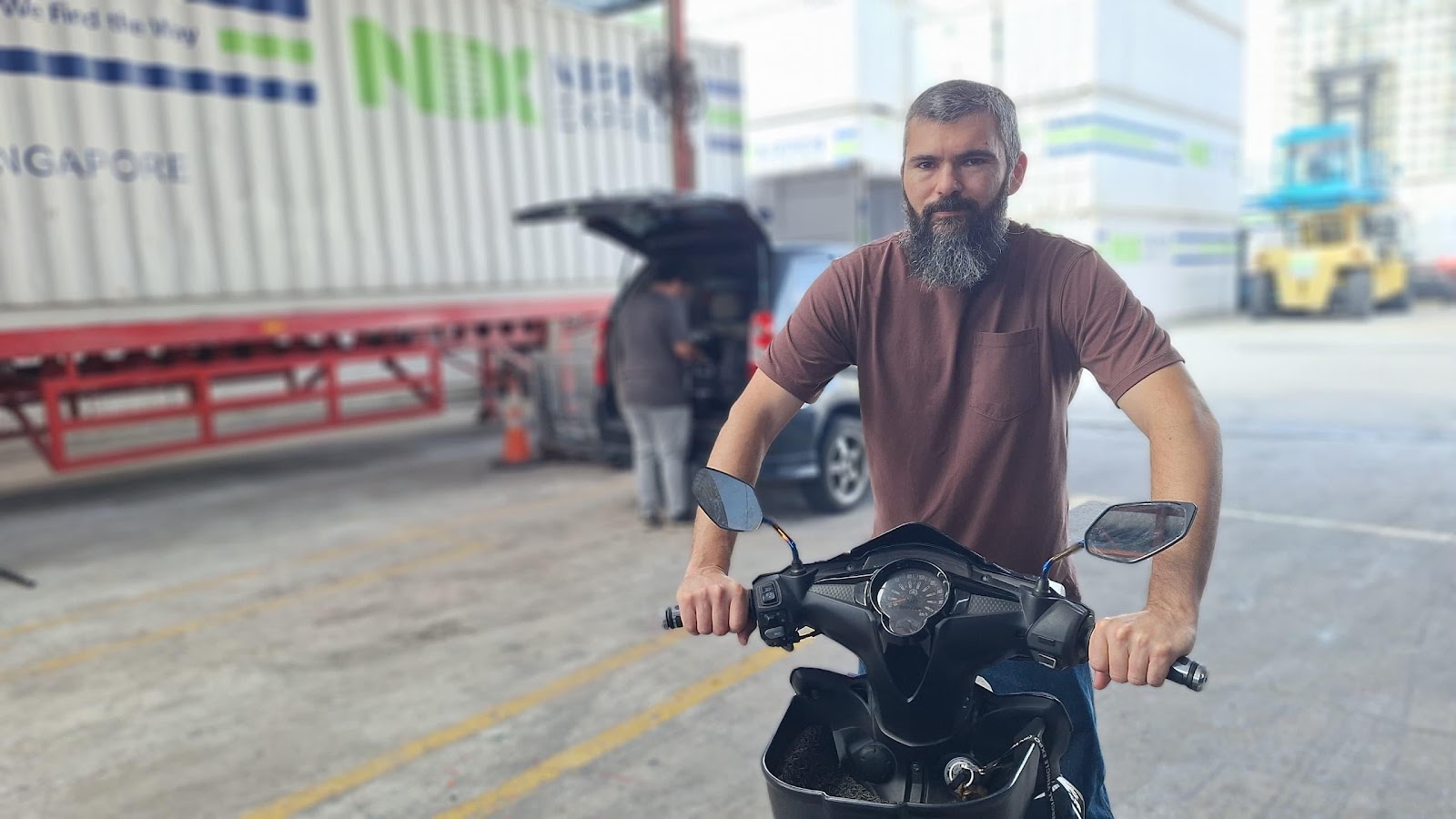 A person on a scooter
Description automatically generated