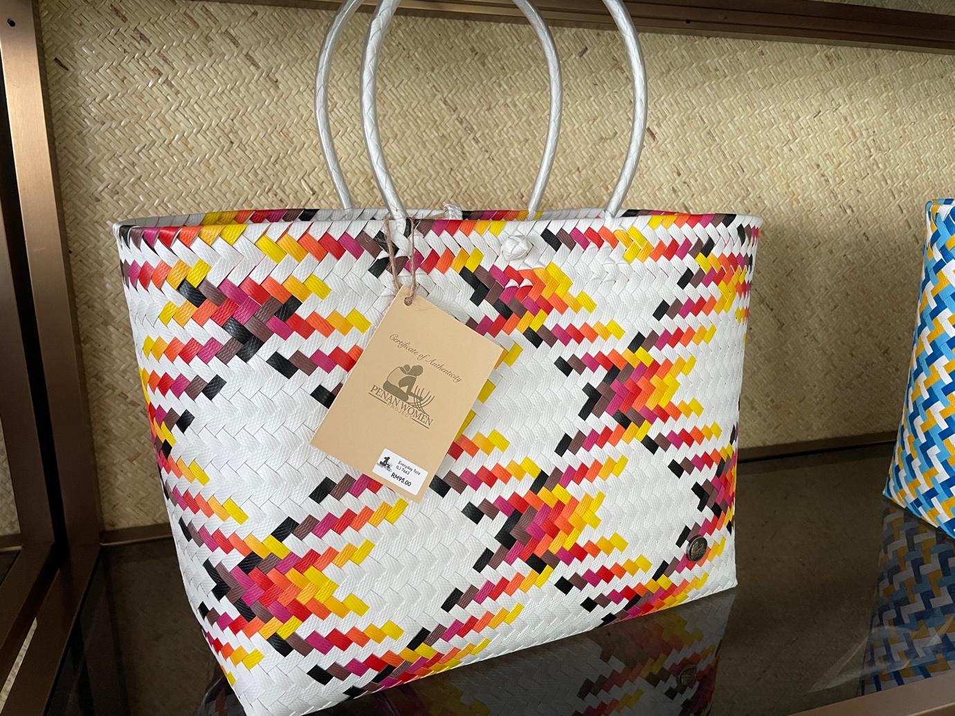 A colorful woven bag on a shelf

Description automatically generated